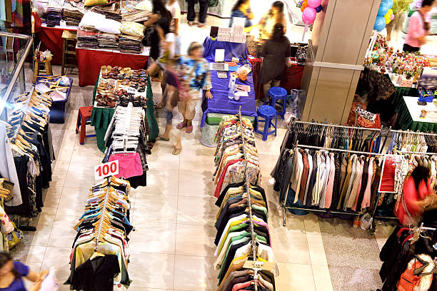 istock Blurred motion people shopping in shopping mall 2227219056