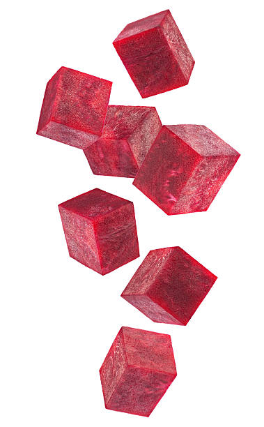 istock Beautifully retouched cubes of beetroot falling in space. Isolated on white 2227220330