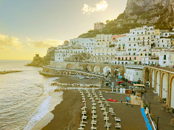 Amalfi and Atrani summer coast at sunset and Tyrrhenian sea with Atrani old town, Italy