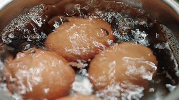 The eggs are boiling in a pot of boiling water