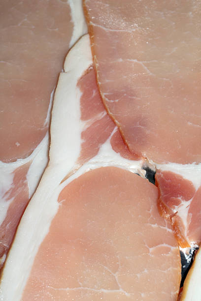 Close up of fresh raw bacon ready to be cooked for breakfast