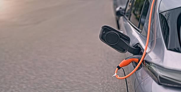 istock Close-up of a electric car being charged. Panoramic image with copy space. 2227226407