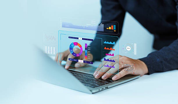 istock Business analysts use computers and dashboards to analyze data and metrics connected to databases for financial technology operations. 2227226867
