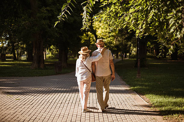 Stock photo of a an Asian American woman receiving support and companion care from a home health aid.