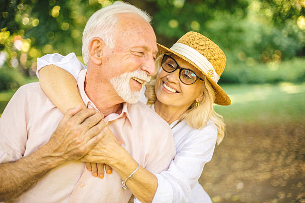 istock Joyful senior couple embracing outdoors in nature 2227229745