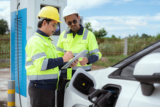 istock Engineers discuss electric vehicle charging station installation during sunny afternoon outdoors 2227231522