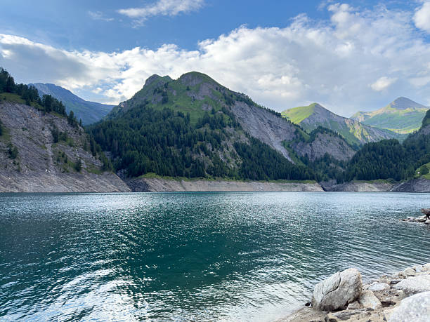 Nestled high in the heart of the Swiss Alps, this alpine lake is a breathtaking example of nature’s raw beauty and serenity.