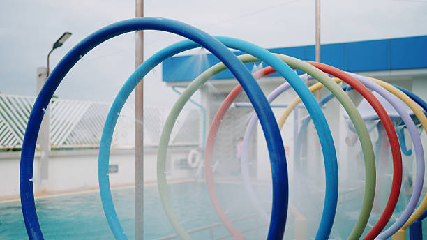 Colorful hoop tunnel baskets at the pool playground.