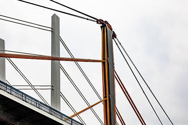 istock Crane lifting cables and electrical wires during bridge construction 2227233894