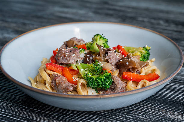 istock Top view of pasta with beef and broccoli. 2227235061