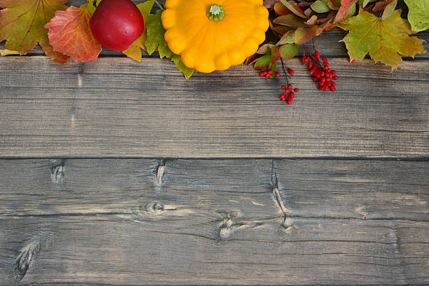istock autumn background with squash, berries and leaves on rustic wood flat lay 2227235176