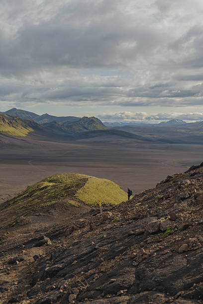 istock Volcanic Landscape with Green Moss and Distant Mountains in Iceland 2227235392