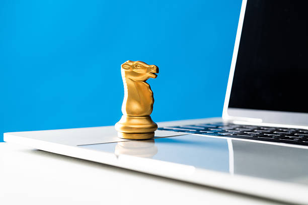 istock Chess knight on laptop keyboard 2227235805