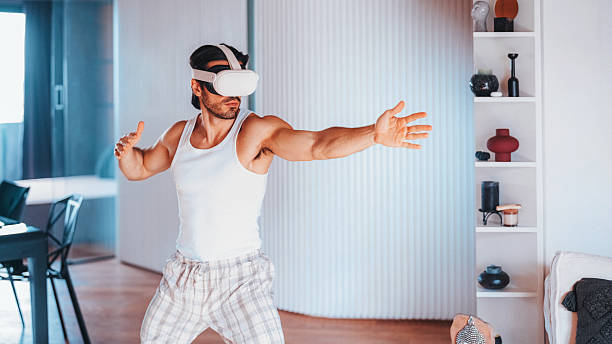 istock Man at home practicing Tai chi with VR glasses 2227239994
