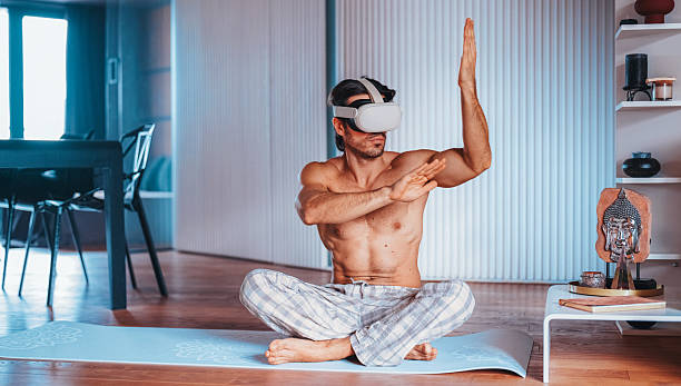 istock Man practicing martial arts with VR headset at home 2227240074