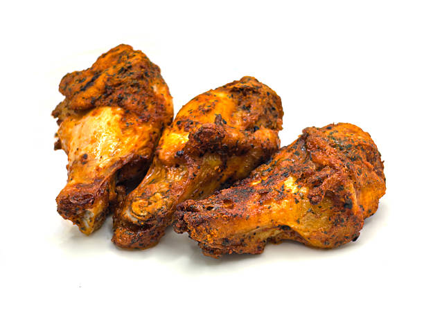 istock Grilled chicken drumsticks isolated on white background 2227243192