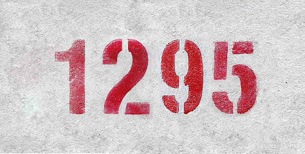 istock red spray-painted number 1295 sprayed onto a white wall. 2227246172