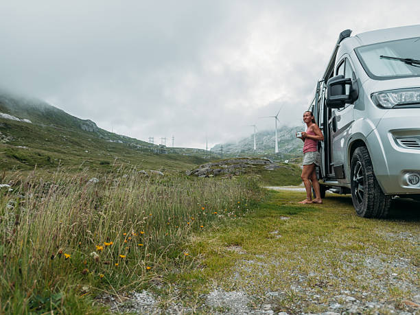 istock Woman Enjoying Coffee by Campervan in Mountains 2227247601