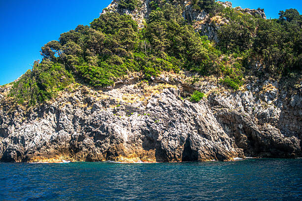A breathtaking view of the Amalfi Coast showcasing dramatic cliffs, crystal-clear blue waters, and charming coastal architecture.