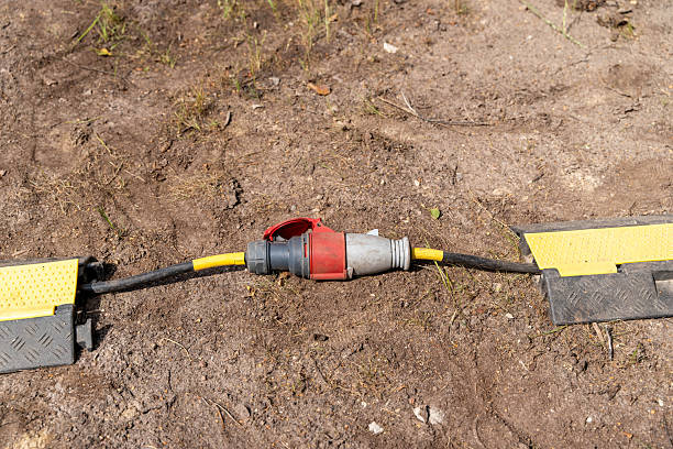 istock Power cable connector lying on ground with cable protector providing safety 2227250192