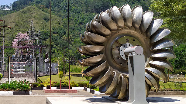 A bank of seven generators inside a hydro-electric dam.
