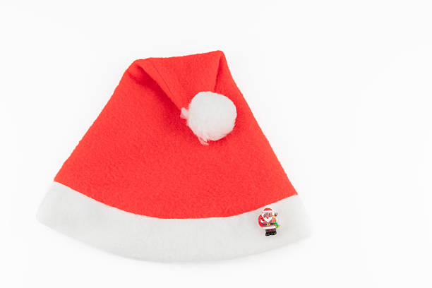 Festive spirit with this classic red Santa Claus hat on black background, perfect for holiday promotions, seasonal greetings, and spreading Christmas cheer this winter season