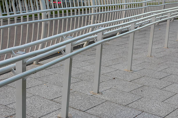 istock Close-up view of metal mesh safety railing system on modern pedestrian bridge infrastructure 2227260426