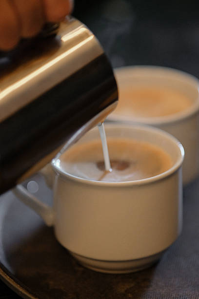 istock Milk being poured for coffee preparation . 2227261053