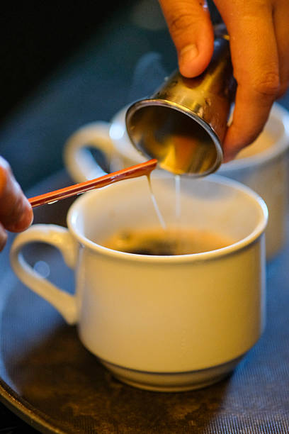 istock Caramel sauce being poured for coffee preparation . 2227261081