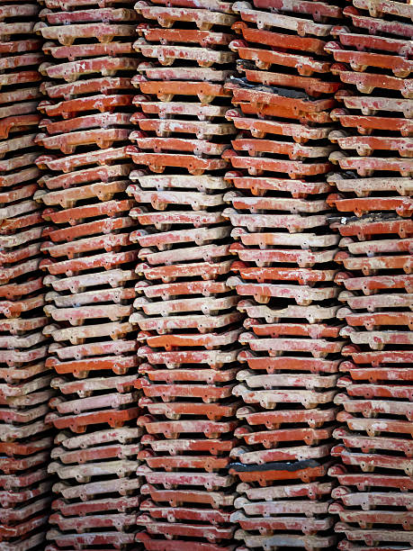 terracotta clay roof tiles stacked high abstract background. construction design element with copy space