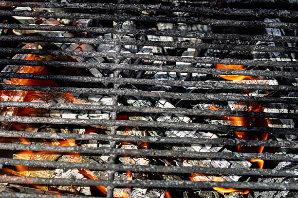 istock Hot empty barbecue BBQ grill with flaming fire and ember charcoal 2227263122