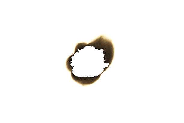 istock Burnt paper hole with scorched and charred edges. Vintage grunge texture or frame element isolated on white background with clipping path. 2227277940