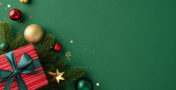 istock Festive Christmas setting with decorated branches, red gift box, and ornaments enhancing the seasonal charm 2227284127