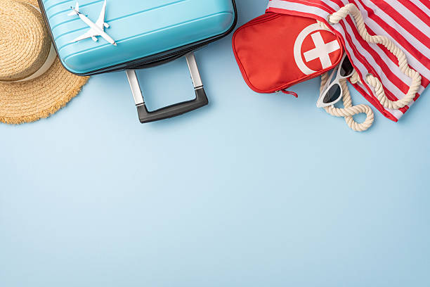 istock A composition of summer travel essentials including a suitcase, sunhat, first aid kit, and more 2227284177