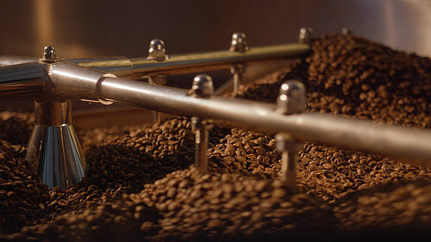 istock Coffee beans roasting in a large industrial coffee roaster 2227285994
