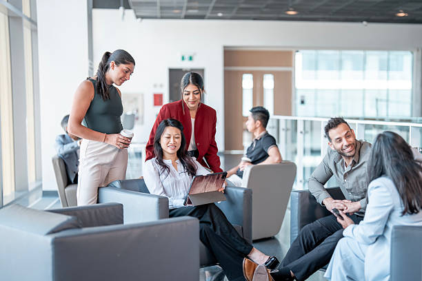 istock Group of Professionals Collaborating in a Modern Office Lounge Setting 2227288322