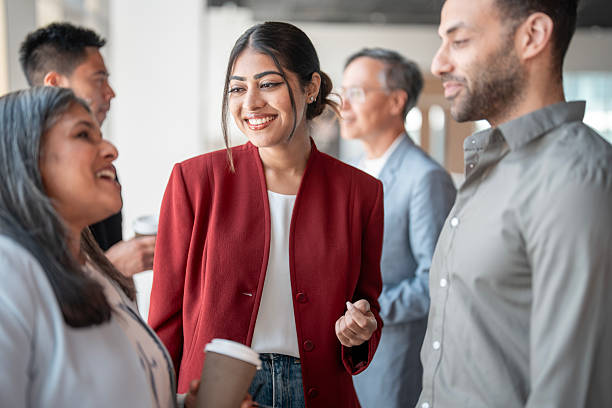 istock Diverse Group of Professionals Smiling and Networking in Modern Office Space 2227288358
