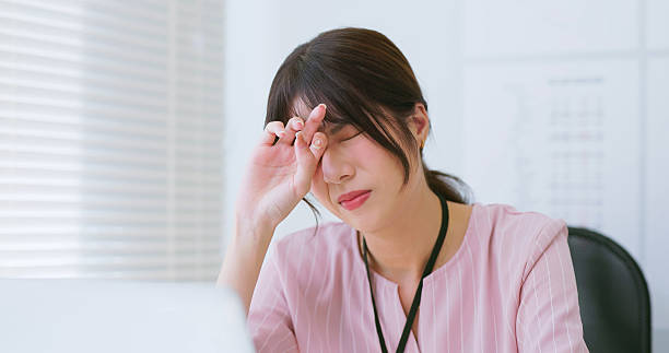istock business woman tired eye uncomfortable 2227290089