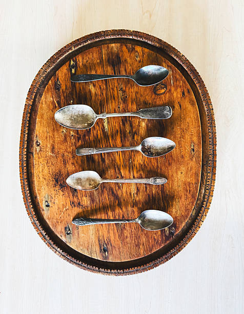 Vintage Spoons On An Old Cutting Board