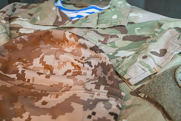 Ukrainian military uniform laid out on a flat surface, featuring a beret and jacket with camouflage patterns in brown and tan, presented indoors under even lighting