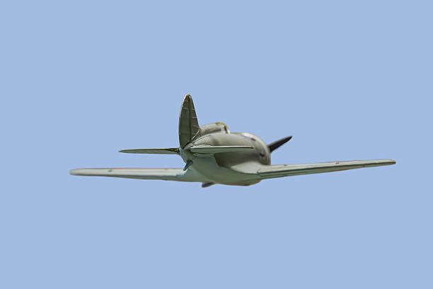 istock Close-up image of a classic single-engine propeller airplane in flight against a clear blue sky, depicted at an angle to show both front and side profile The aircrafts fuselage, tail assembly, wing 2227292866