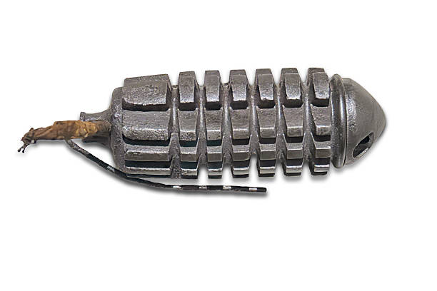 istock A worn, steel gear resembling a grenade, displayed from above with no surrounding context Even lighting in a straightforward photograph style 2227292928