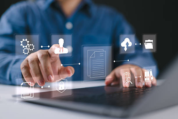 istock Businessman using a laptop to document management concept, online documentation database and digital file storage system software, records keeping, database technology, file access, doc sharing. 2227294138