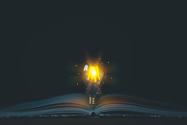 istock A glowing light bulb emerges from an open book, symbolizing knowledge, and new ideas. Concepts of innovation, education, and intellectual discovery, with a focus on enlightenment and inspiration. 2227294351