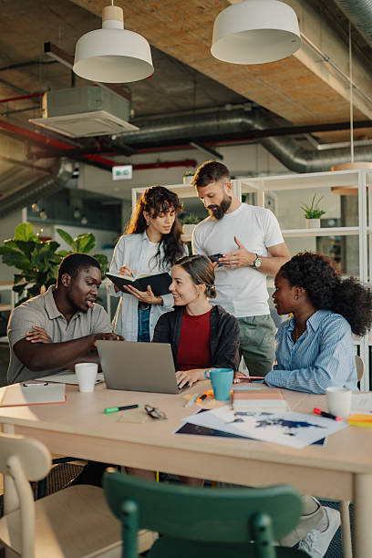 istock Diverse team collaborating on a project in a modern office 2227295460