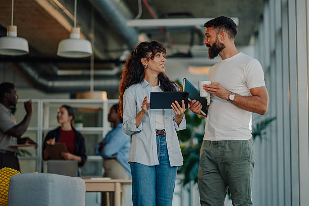 istock Business colleagues collaborating, discussing work in modern office 2227295573