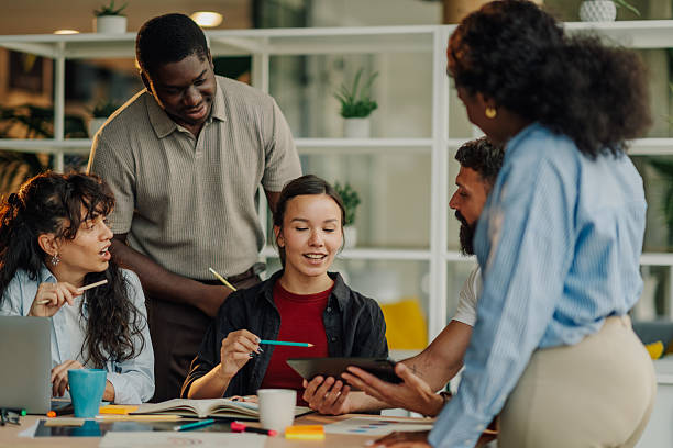 istock Diverse business team collaborating on project using digital tablet in modern office 2227295626