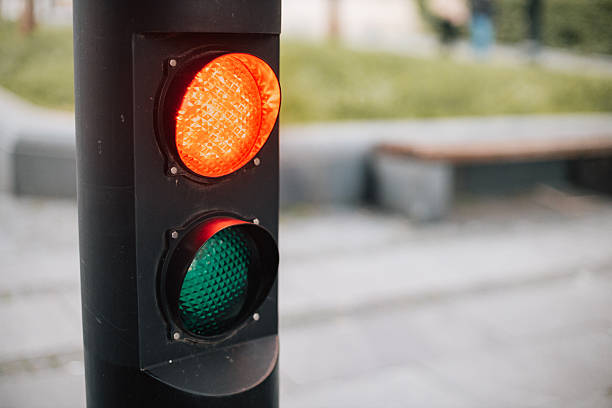 istock Modern traffic light displaying red and green signals at pedestrian zone 2227298166