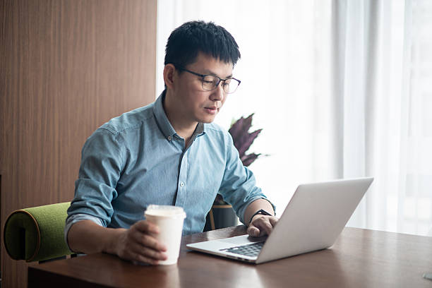 istock An Asian businessman working on a laptop in the office 2227311122