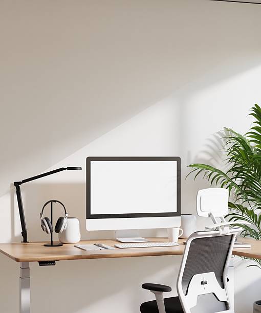 istock Poster Frame Mockup with Computer Screen in Modern Minimalist Home Office Interior 2227312031